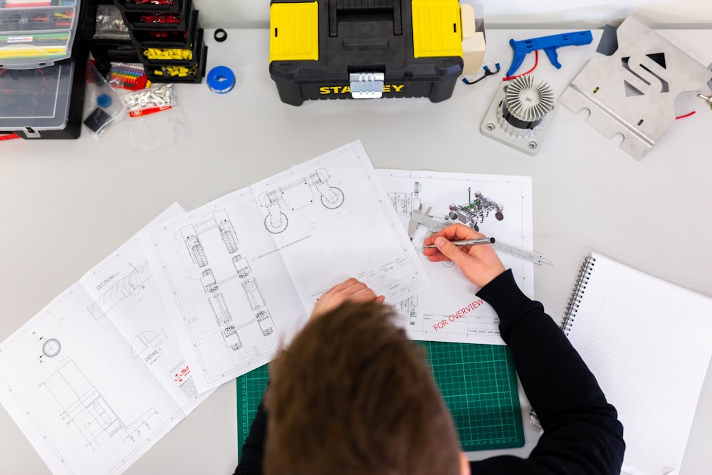 Engineers reviewing technical drawings on site